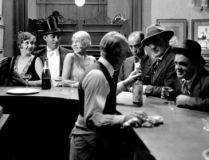 Bartender serves thirsty white patrons
